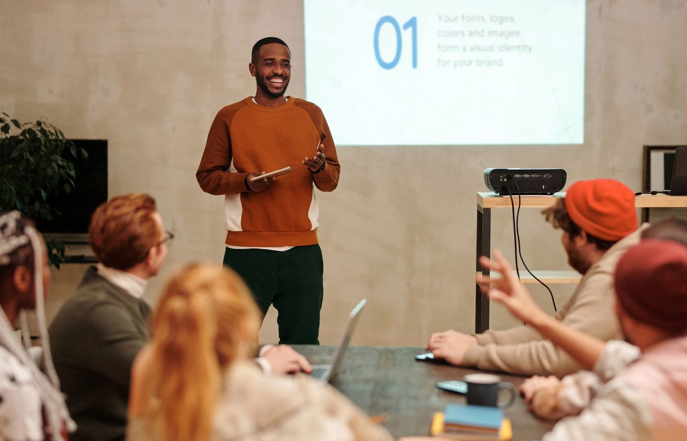 A speaker presenting to a group of professionals
